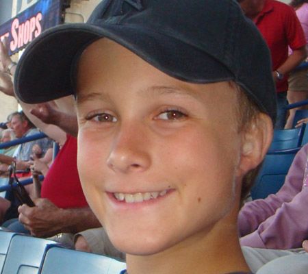 Revision microtia reconstruction patient smiling at sports game